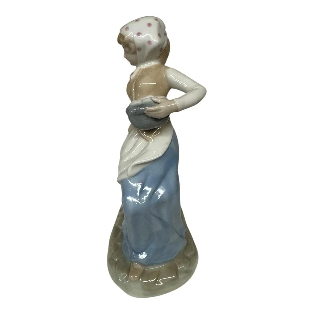 1980 Enesco Fine Porcelain Lady Carrying Eggs with Goose Tugging at Dress‎